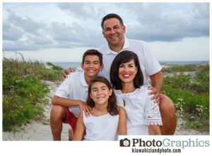 beautiful family of four sitting in the sand, kiawah island family photography