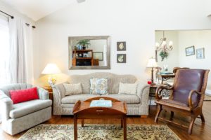 Updated photos of living room with better real estate photography for rentals